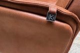KAWOLA Relaxsessel JOSIANE Drehsessel Lederfaserstoff cognac mit Hocker